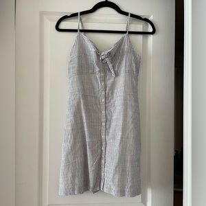 Striped dress with adjustable straps and pockets from Francesca’s. Size small.